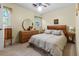 Comfortable bedroom with light walls, wood furniture, and a ceiling fan at 411 Dogwood Circle, Summerville, SC 29485