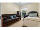 Bedroom featuring a bed, futon, and large window at 411 Dogwood Circle, Summerville, SC 29485