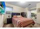Well-lit bedroom with two large windows and hardwood furniture at 411 Dogwood Circle, Summerville, SC 29485
