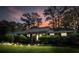 Charming single-story home with a well-maintained front yard at sunset at 411 Dogwood Circle, Summerville, SC 29485
