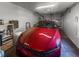 Garage featuring a shiny red car, ample storage, and an organized space at 411 Dogwood Circle, Summerville, SC 29485