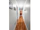 Long hallway with wood floors leading to the living area at 411 Dogwood Circle, Summerville, SC 29485