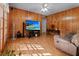 Comfortable living room features a large TV, cozy sofa, and an adjacent sunroom with a sliding door at 411 Dogwood Circle, Summerville, SC 29485