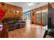 Spacious living room with hardwood floors, comfortable seating, and access to adjacent rooms and outdoor spaces at 411 Dogwood Circle, Summerville, SC 29485