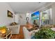 Bright living room with large TV, comfortable sofa, and an adjacent outdoor seating area at 411 Dogwood Circle, Summerville, SC 29485
