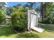 Outdoor storage shed with a concrete ramp and surrounded by lush greenery providing secure storage at 411 Dogwood Circle, Summerville, SC 29485