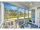 Inviting back porch, screened in, provides an ideal outdoor living space to relax and enjoy the outdoors at 414 Hamlet Cir, Goose Creek, SC 29445