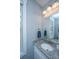 Bathroom with white vanity, granite countertop, and a decorative mirror at 414 Hamlet Cir, Goose Creek, SC 29445