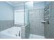 Modern bathroom featuring a glass-enclosed shower and a separate bathtub at 414 Hamlet Cir, Goose Creek, SC 29445