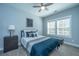 Cozy bedroom with stylish decor, ceiling fan, and abundant natural light from the double window at 414 Hamlet Cir, Goose Creek, SC 29445