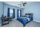 Comfortable bedroom featuring a ceiling fan, work desk and chair set against a backdrop of natural light at 414 Hamlet Cir, Goose Creek, SC 29445