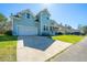 Charming two-story home with a well-manicured lawn, inviting curb appeal, and a two car garage at 414 Hamlet Cir, Goose Creek, SC 29445
