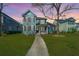 Beautiful two-story house featuring charming curb appeal, a well-maintained lawn and a sidewalk at 414 Hamlet Cir, Goose Creek, SC 29445