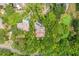 Aerial view of '43 Surfsong' nestled amongst verdant trees, boasting a private pool and serene surroundings at 43 Surfsong Rd, Kiawah Island, SC 29455