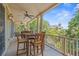 Spacious covered porch with dining table and scenic views, perfect for outdoor entertaining at 43 Surfsong Rd, Kiawah Island, SC 29455
