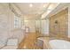The bathroom features a glass-enclosed shower, standalone tub, and elegant fixtures at 43 Surfsong Rd, Kiawah Island, SC 29455