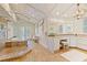 A spacious bathroom featuring a glass enclosed shower, standalone tub, and elegant fixtures at 43 Surfsong Rd, Kiawah Island, SC 29455