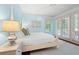 Bright bedroom featuring a four-poster bed, natural lighting, and white walls at 43 Surfsong Rd, Kiawah Island, SC 29455
