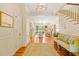 Inviting foyer boasts hardwood floors, elegant lighting, and seamless transition to the living area and staircase at 43 Surfsong Rd, Kiawah Island, SC 29455