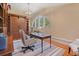 Sunlit home office with custom built-ins, hardwood floors, and stylish decor at 43 Surfsong Rd, Kiawah Island, SC 29455