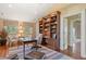 Well-appointed home office with custom built-ins, hardwood floors, and ample natural light at 43 Surfsong Rd, Kiawah Island, SC 29455