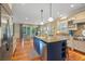 Bright kitchen with a center island, barstool seating, and an open layout perfect for entertaining at 43 Surfsong Rd, Kiawah Island, SC 29455