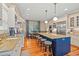 Well-equipped kitchen with a center island, bar seating, and direct access to the dining area and stainless appliances at 43 Surfsong Rd, Kiawah Island, SC 29455