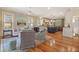 Comfortable living room with plush seating and an open layout that seamlessly connects to the eat-in kitchen at 43 Surfsong Rd, Kiawah Island, SC 29455