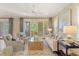 Comfortable living room featuring stylish decor, abundant natural light, and seamless access to an outdoor area at 43 Surfsong Rd, Kiawah Island, SC 29455