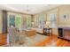 Cozy living room showcasing hardwood floors, modern furnishings, stylish decor, and access to an outdoor space at 43 Surfsong Rd, Kiawah Island, SC 29455