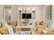 Inviting living room with a TV and built-in shelving, light colors, and comfortable seating at 43 Surfsong Rd, Kiawah Island, SC 29455