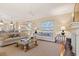 Bright and spacious living room showcasing hardwood floors, neutral colors, and an open floor plan for easy entertaining at 43 Surfsong Rd, Kiawah Island, SC 29455