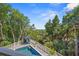 Backyard pool and lounge area offer a private retreat surrounded by lush landscaping at 43 Surfsong Rd, Kiawah Island, SC 29455