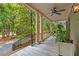 Charming porch framed by white columns and lush greenery creates a peaceful retreat at 43 Surfsong Rd, Kiawah Island, SC 29455