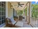 Inviting porch featuring comfortable seating, classic columns, and a tranquil outdoor setting at 43 Surfsong Rd, Kiawah Island, SC 29455