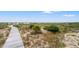 Picturesque boardwalk trail winding through sand dunes and native vegetation at 43 Surfsong Rd, Kiawah Island, SC 29455