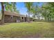 Expansive backyard with mature trees, a brick house exterior, and a well-maintained lawn at 436 Fox Hunt Rd, Goose Creek, SC 29445