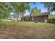 Spacious backyard with brick exterior home, patio, and lush greenery, perfect for outdoor living at 436 Fox Hunt Rd, Goose Creek, SC 29445