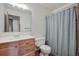Bathroom featuring a wooden vanity with a large mirror, a toilet, and a shower curtain at 436 Fox Hunt Rd, Goose Creek, SC 29445