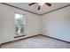 Bedroom featuring carpeted flooring, a ceiling fan, and a window overlooking trees outside at 436 Fox Hunt Rd, Goose Creek, SC 29445