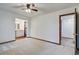 Large bedroom with carpet, ceiling fan, attached bathroom, and adjacent closet space for organized storage at 436 Fox Hunt Rd, Goose Creek, SC 29445