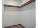 Walk-in closet with plain white walls and floor, wooden support beams at 436 Fox Hunt Rd, Goose Creek, SC 29445