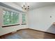 Bright dining area featuring hardwood floors, large windows, and a modern chandelier at 436 Fox Hunt Rd, Goose Creek, SC 29445