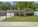 Lovely home with a large driveway, attached garage, and mature trees at 436 Fox Hunt Rd, Goose Creek, SC 29445