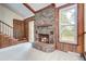 Cozy living room with brick fireplace, wood beams, and wood paneling accents create a warm inviting atmosphere at 436 Fox Hunt Rd, Goose Creek, SC 29445