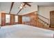 Spacious living room with wood paneled walls and stairway at 436 Fox Hunt Rd, Goose Creek, SC 29445