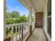 Covered porch with white railings, brick accents, and outdoor views at 436 Fox Hunt Rd, Goose Creek, SC 29445