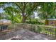 Wooden deck offers a backyard view shaded by a large tree, creating a peaceful outdoor retreat at 444 Clarine Dr, Goose Creek, SC 29445