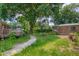 The backyard has a brick home with a deck, winding walkway and storage shed for all your outdoor needs at 444 Clarine Dr, Goose Creek, SC 29445