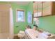 Bathroom with vanity, toilet, shower/tub combo, and window offering natural light at 444 Clarine Dr, Goose Creek, SC 29445